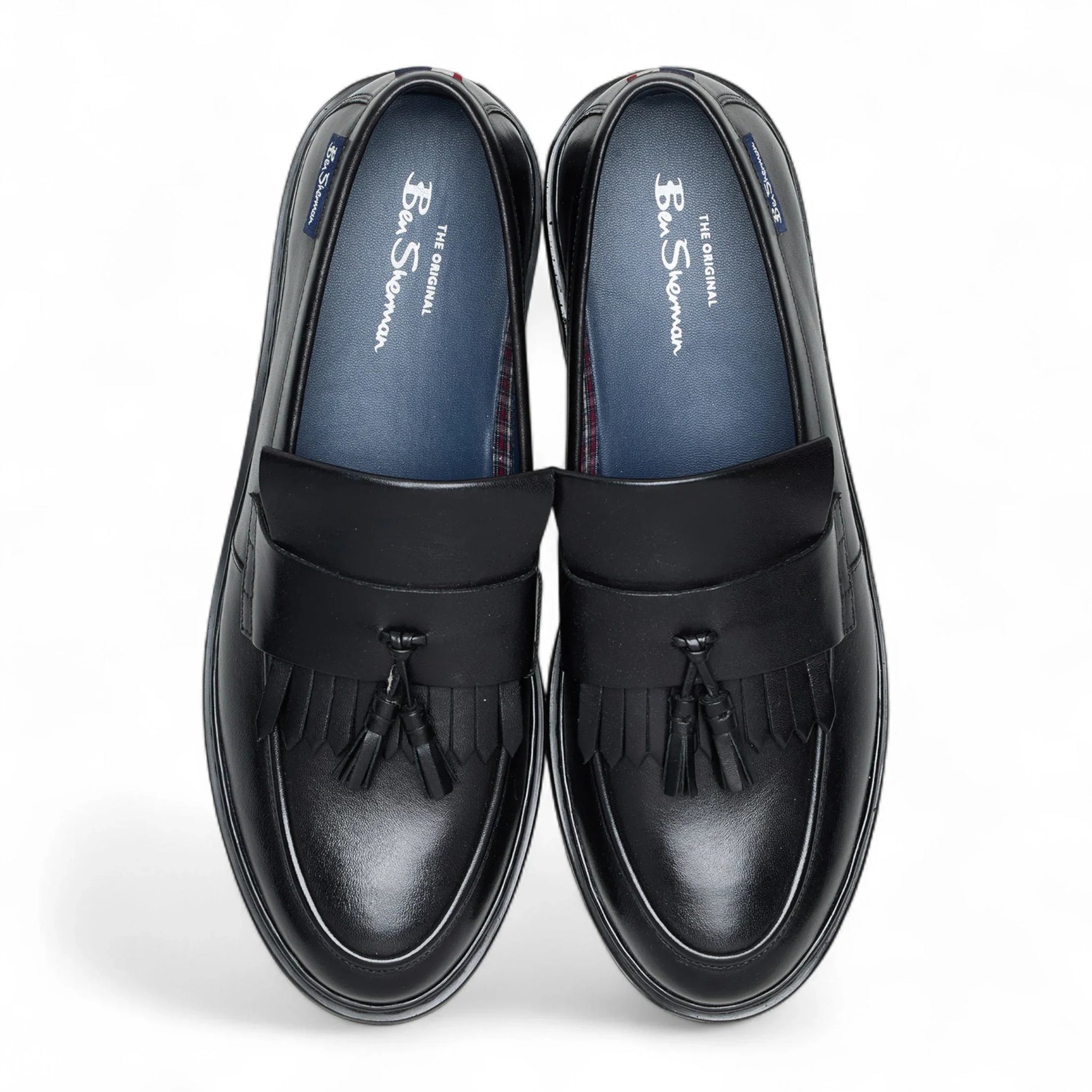 Schwarze Herren-Slipper aus Leder mit dicker Sohle und Quasten